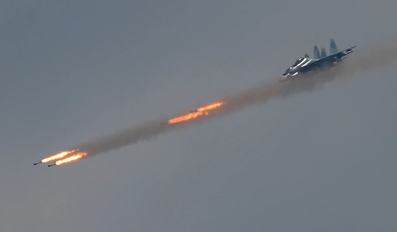 A Sukhoi Su-30 SM jet fighter fires missiles 